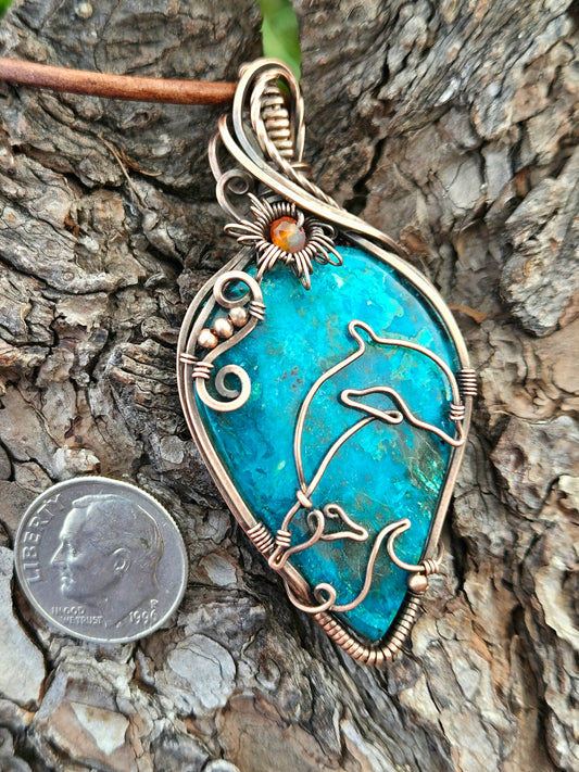 Handmade wire wrapped dolphin pendant using a beautiful chrysacolla in antiqued copper wire