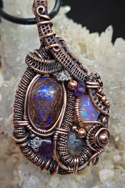 Handmade wire wrapped boulder opal pendant with Ethiopian opal, amethyst and labradorite in raw copper wire