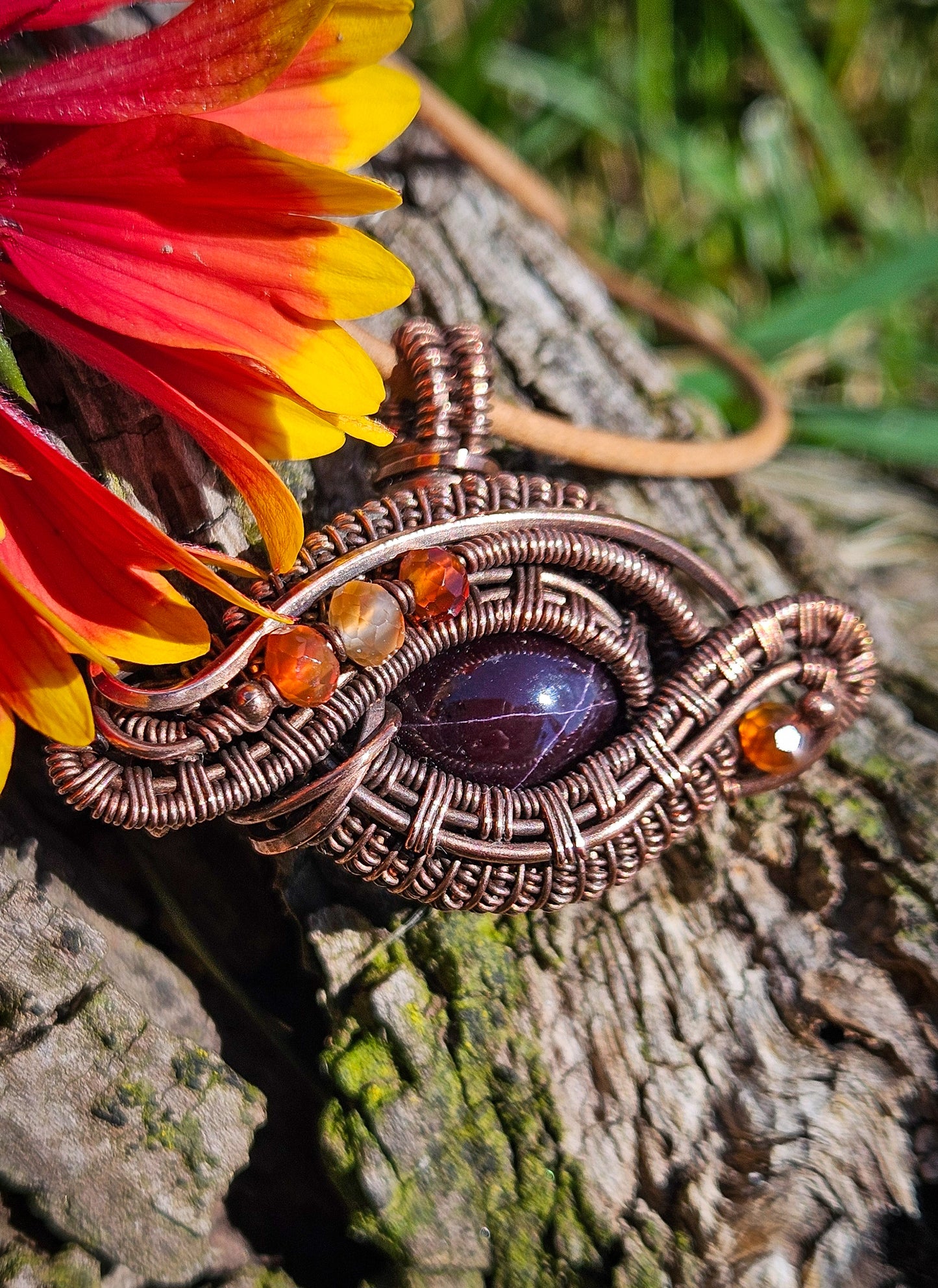 Wire wrapped star garnet eye pendant