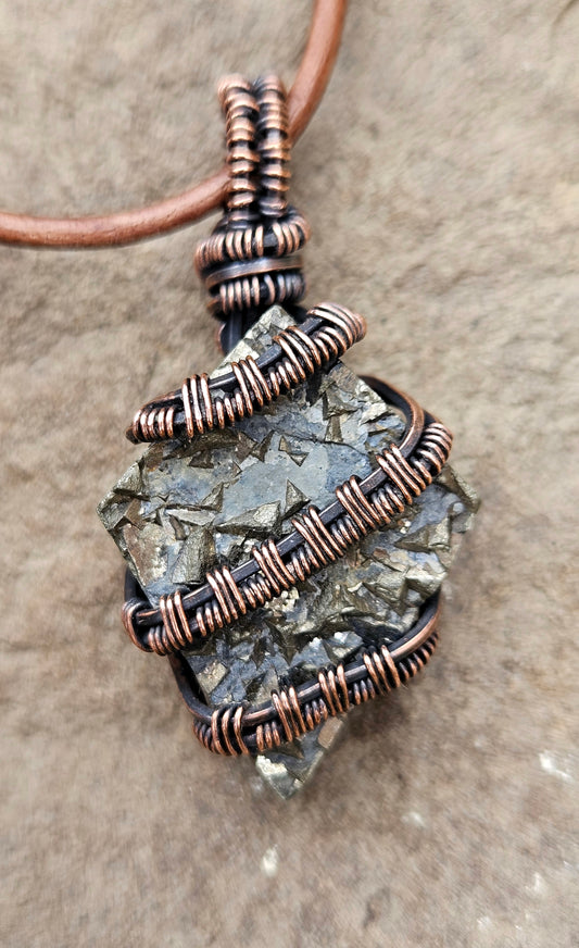 Handmade wire wrapped unique pyrite pendant in copper wire