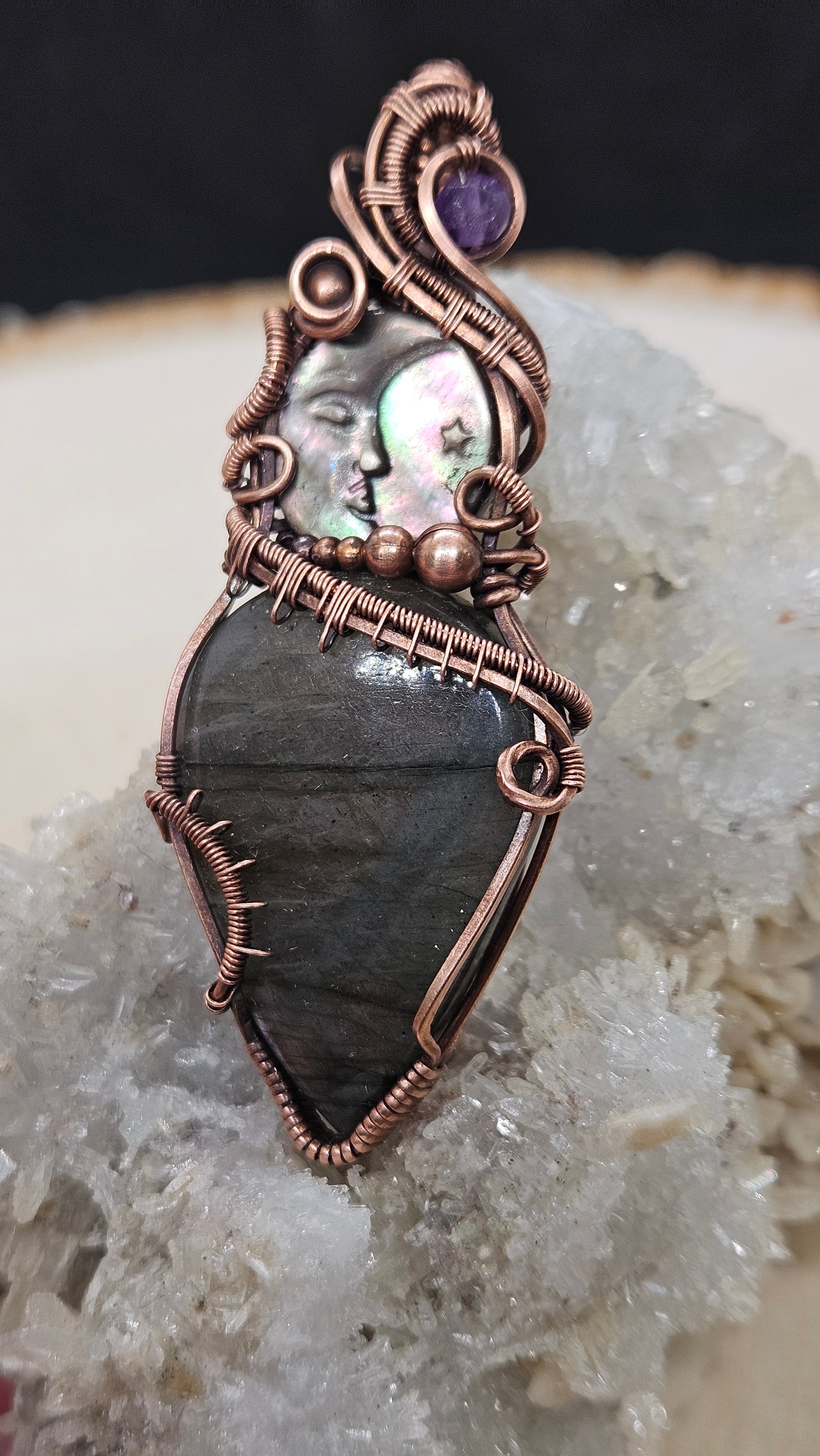 Wire wrapped labradorite with carved moon shell