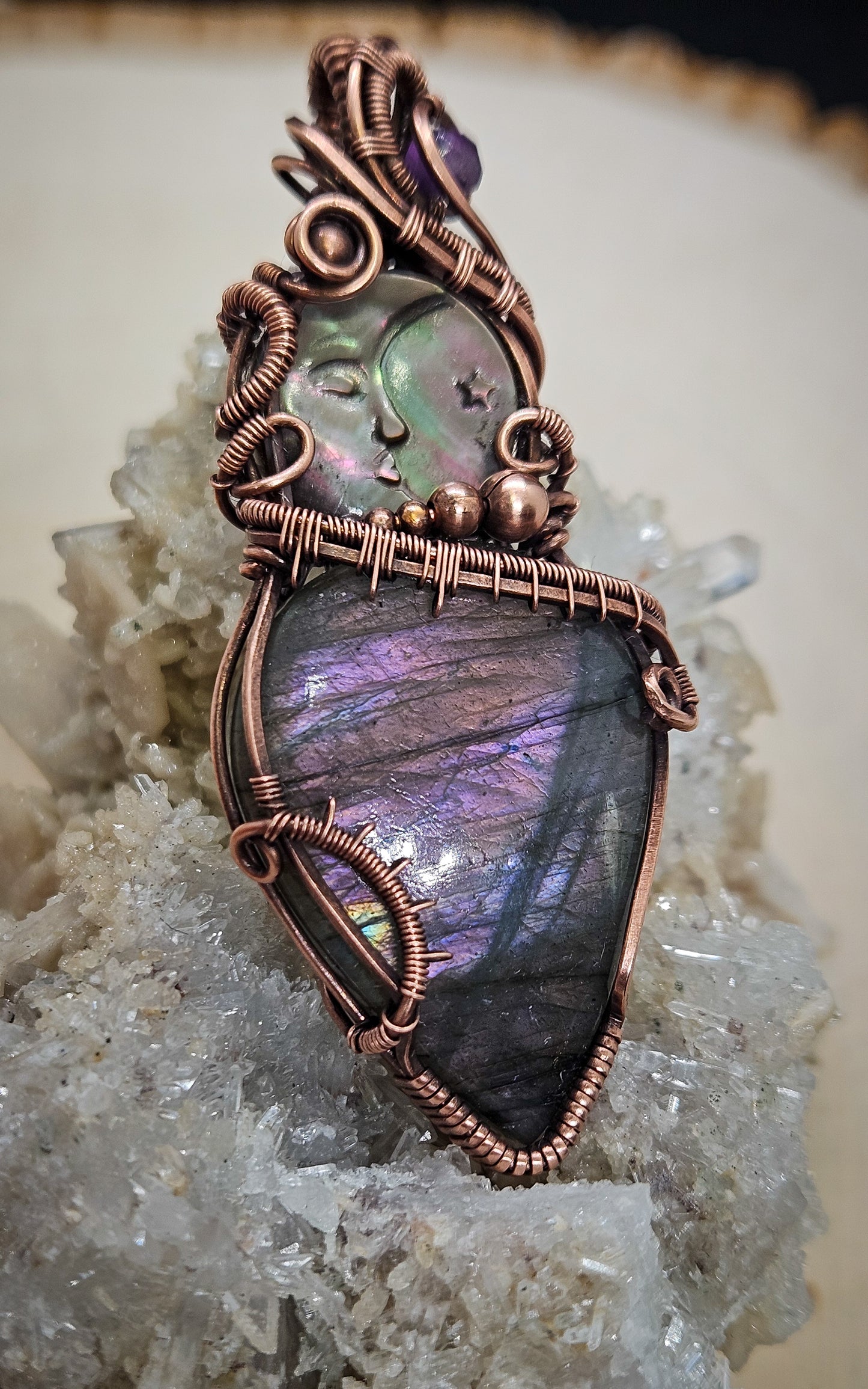 Wire wrapped labradorite with carved moon shell