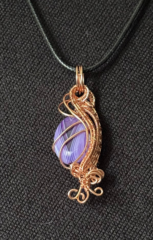 Purple banded stone pendant