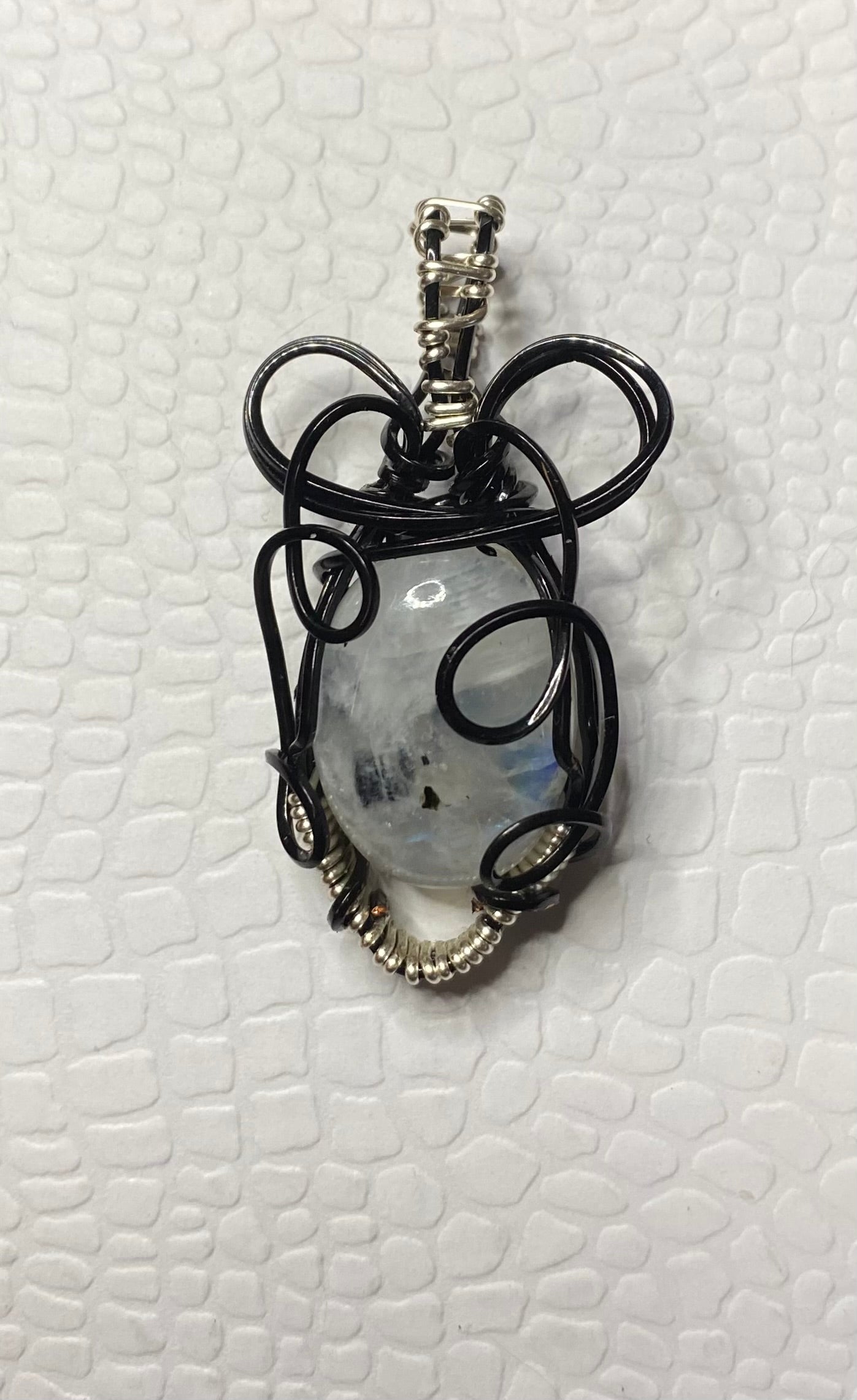 Rainbow Moonstone In black with silvertone accents