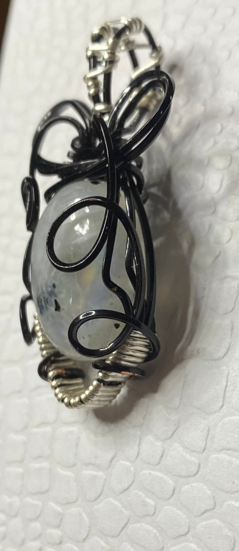 Rainbow Moonstone In black with silvertone accents