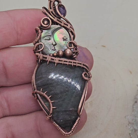 Wire wrapped labradorite with carved moon shell