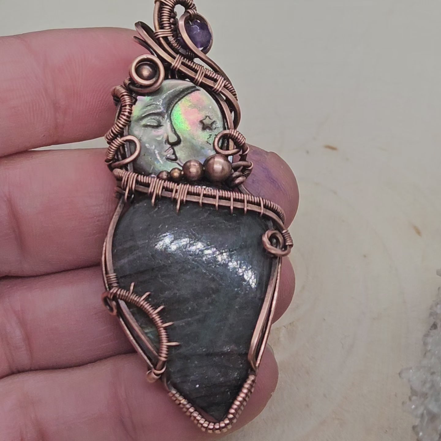 Wire wrapped labradorite with carved moon shell